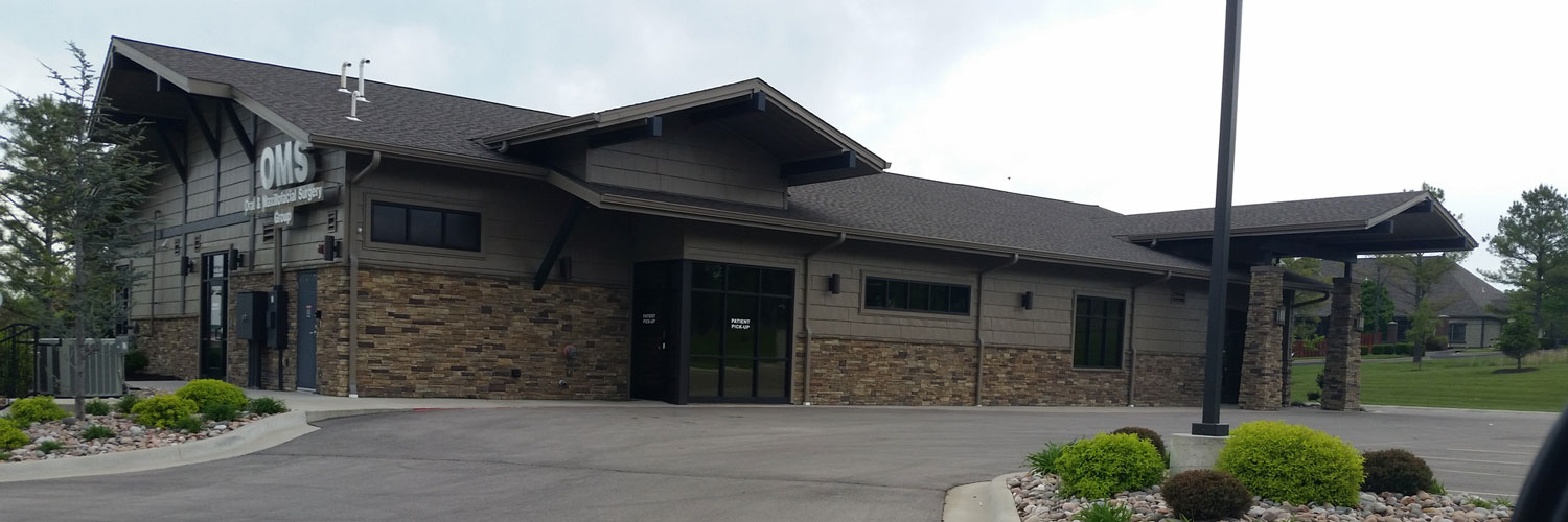 commercial building with new brown roof Seamless Experts residential and commercial exterior remodeling Ozarks Missouri